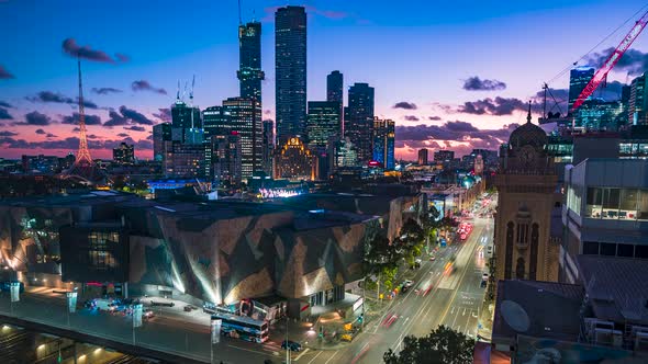 Melbourne Australia Victoria city looking at federation square at sunset with car motion blur timela