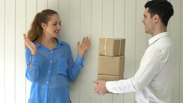 smart caucasian man sent brown box to beautiful female office partner delivery ideas concept