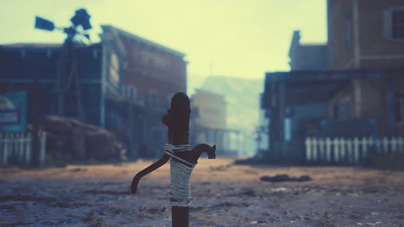 Old Rusted Water Pump in Wild West Town alt