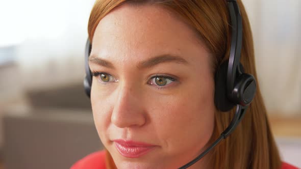 Woman with Headset and Laptop Working at Home