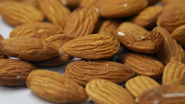 Male Hand Takes One Almond Nut