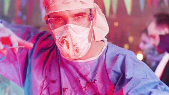 Crazy Physicist Turning To the Camera and Showing His Mad Face at a Halloween Party