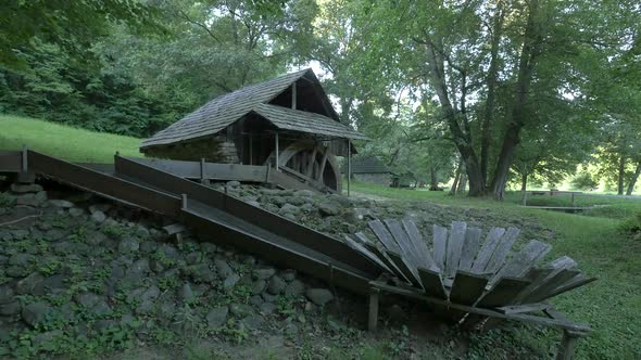 Wooden watermill in the forest