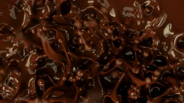 Super Slow Motion Detail Shot of Splashing Melted Chocolate at 1000 Fps