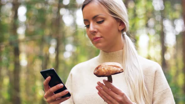 Woman with Mushroom and Smartphone in Forest 20