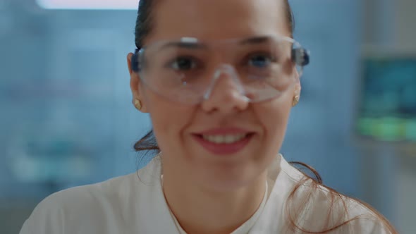 Biologist with Safety Goggles Smiling at Camera