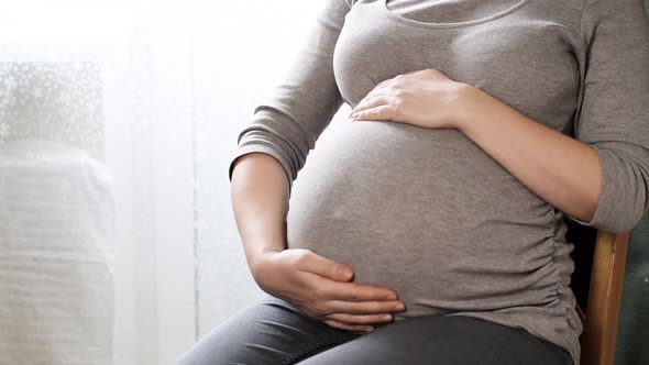 Pregnant Woman with Big Belly Relax at Home