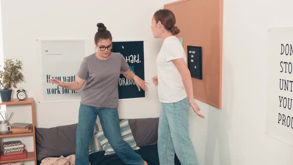 Female Friends Dancing on Bed and Having Fun