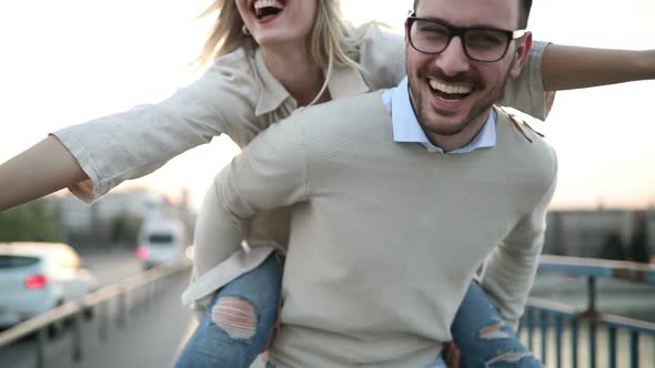 Couple in Love Dating Outdoor in Sunset and Smiling