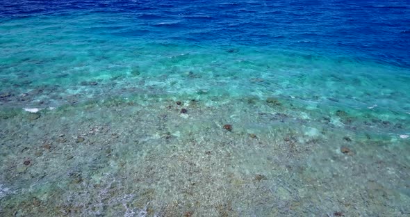 Beautiful flying copy space shot of a white sandy paradise beach and blue ocean background in best q