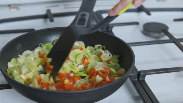 Add vegetables in the fry pan.