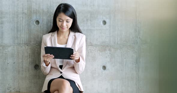 Business woman working on tablet computer 