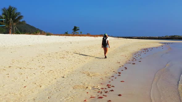 Ladies enjoying life on tropical shore beach holiday by blue sea with white sand background of Thail