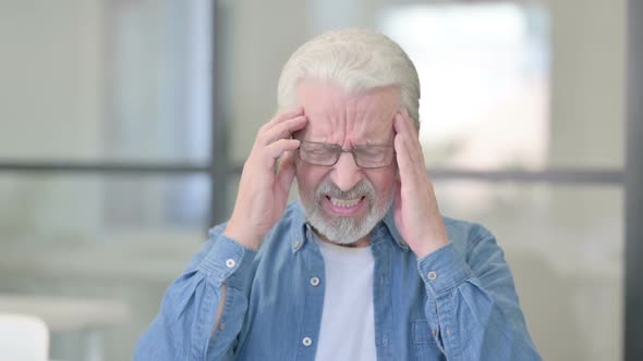 Portrait of Senior Old Man Having Headache