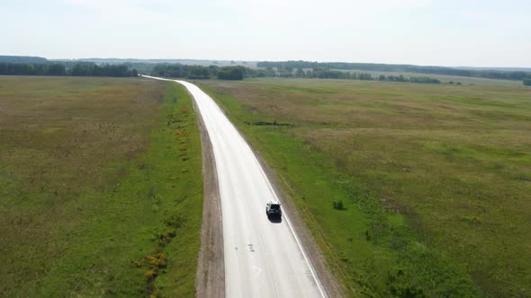 Aerial View of a Traveler's Car on the Road