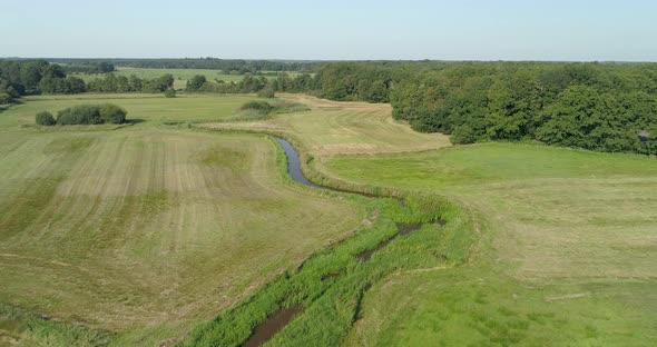 Aerial view of small winding river Reest.