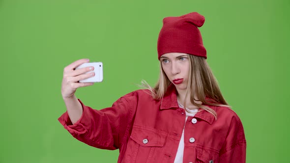 Teenager Makes Selfie with Different Emotions. Green Screen. Slow Motion