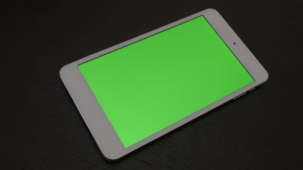 Green screen display on silver PC tablet slow panning 4K 3840X2160 UHD video - Tablet PC with greens