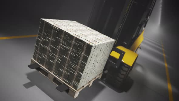 Yellow forkliftcarrying a pile of money on the wooden pallet in the warehouse.