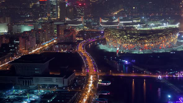 Beijing Night Aerial Cityscape National Stadium in Beijing Olympic Park with Road Traffic China
