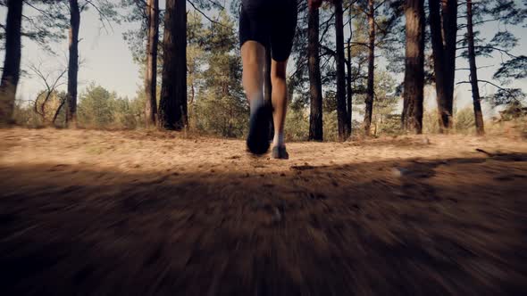 Runner Legs. Running In Forest. Athlete Professional Runner Jogging.Triathlete Running,Sprinting