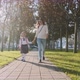 Mother and Little Daughter in Uniform Going To School at Morning, Steadicam - VideoHive Item for Sale