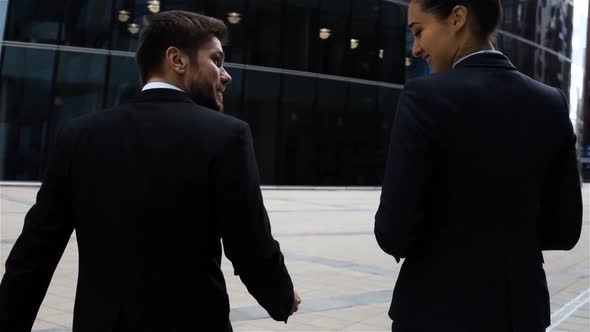 Business Partners Men and Women Doing a Handshake