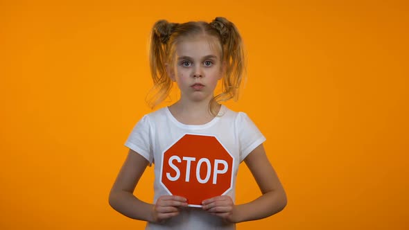 Preteen Girl Showing Stop Sign, Family Misbehavior, Children Rights Protection