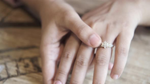 Close Up of Women's Hands with Wedding Ring