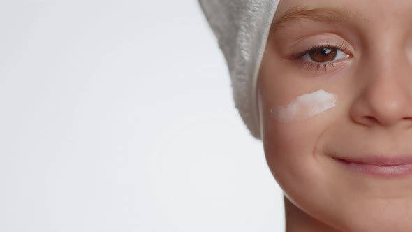 Pretty Young Child Girl Applying Cleansing Moisturizing Face Cream Skincare Natural Creme Cosmetics