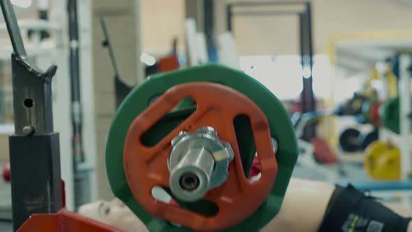 Young Girl Athletic Build Training in the Gym 5 She Lifts Bar Lying Down