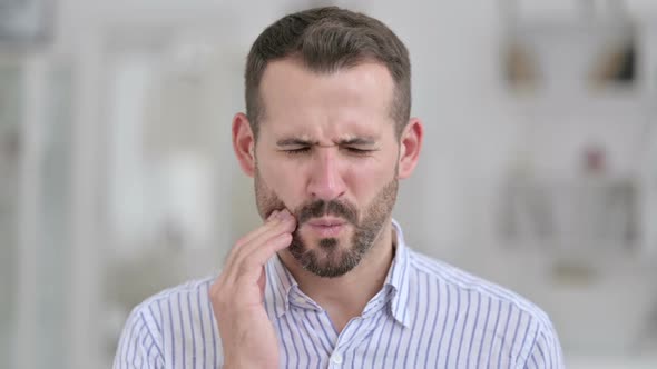 Portrait of Sick Young Man Having Toothache