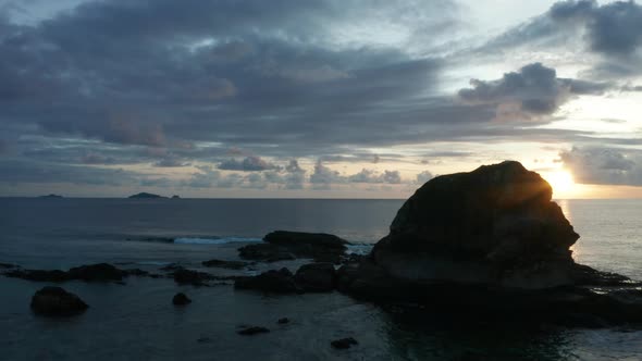 The Vast South Pacific Ocean And The Rocky Island Of Kuata Under The Sunset. -aerial shot