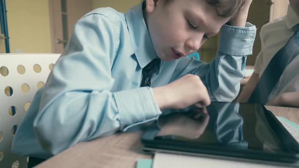 Pupil works on tablet computer