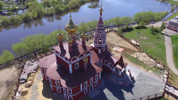 Aerial Drone Shot People Come to Church on a Summer Day a Big Church on the Big River