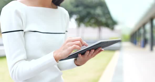 Woman use of tablet at outdoor