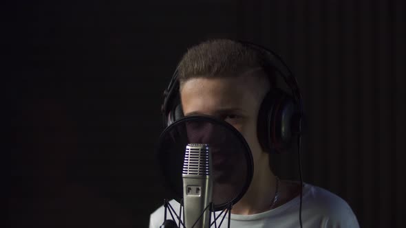 Boy Singing in Studio Microphone