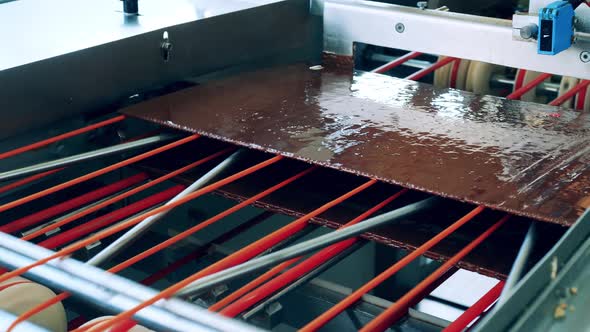 Chocolate Waffle Layers Going Through the Confectionery Machine