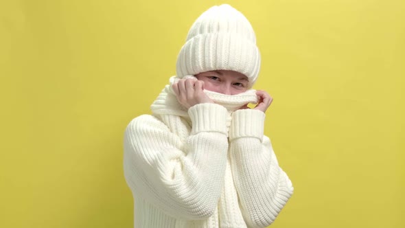 Young Smiling Woman Wearing White Knitted Sweater Scarf and Hat