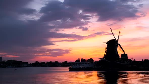 Windmills at Zaanse Schans in Holland on Sunset. Zaandam, Nether