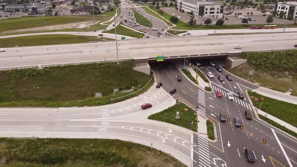 Cars Driving Through Diverging Diamond Road In Madison Heights and Troy Michigan - Aerial shot