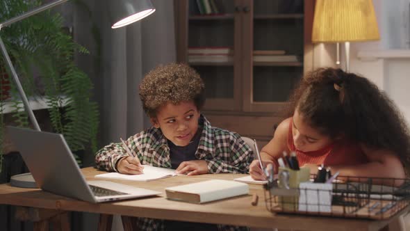 Afro Siblings Having Fun Doing Homework