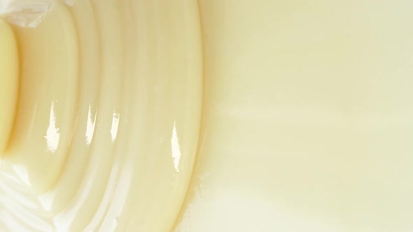 White Yogurt Sauce Milk Caramel Texture Close Up Abstract Beige Cream Motion