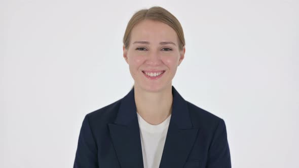 Young Businesswoman Smiling at Camera on White Background