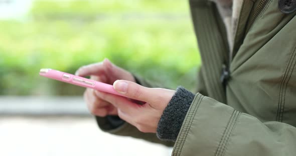 Woman use of mobile phone in the park