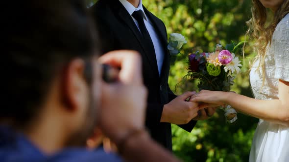 Groom holding bride hand and photographer taking photo 4K 4k