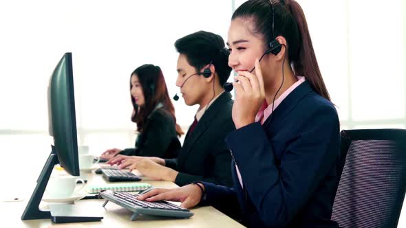 Business People Wearing Headset Working in Office