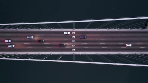  Aerial Top Down Shot of Vehicles Driving By Bay Bridge Towards San Francisco