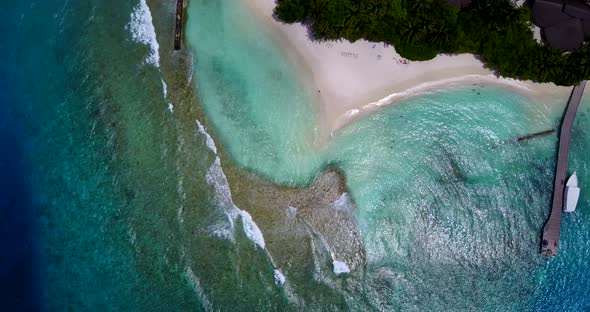 Tropical drone abstract shot of a sunshine white sandy paradise beach and aqua blue water background