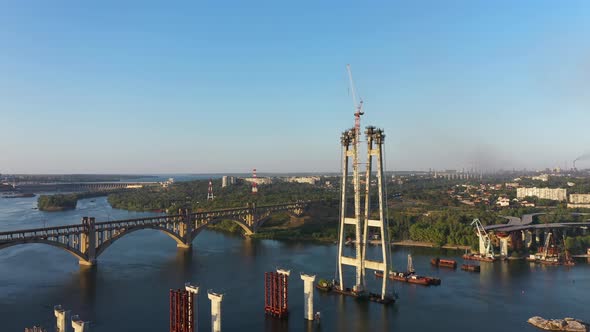 Incomplete Automobile Bridge on the Background of an Industrial City